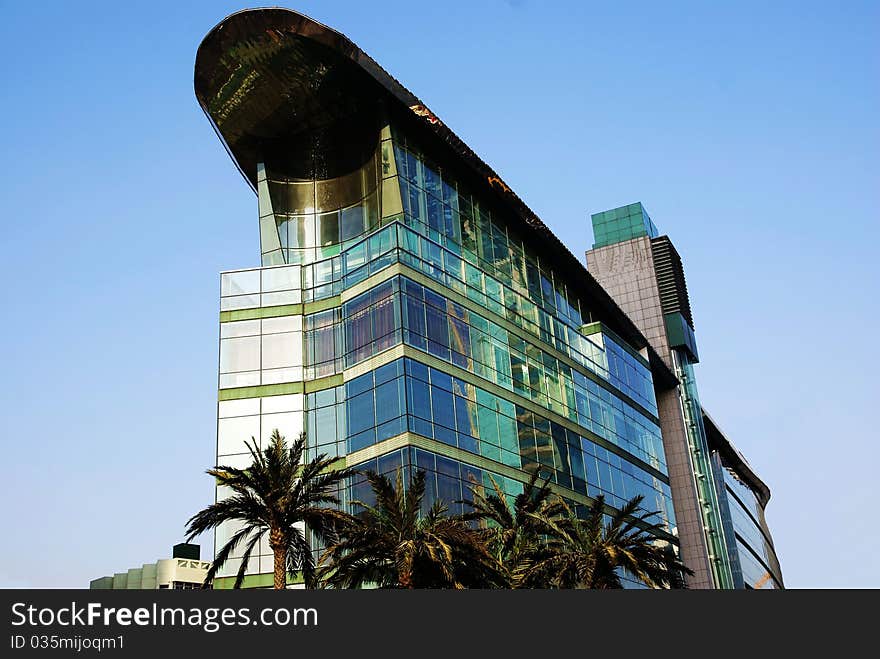 glass building isolated in blue sky