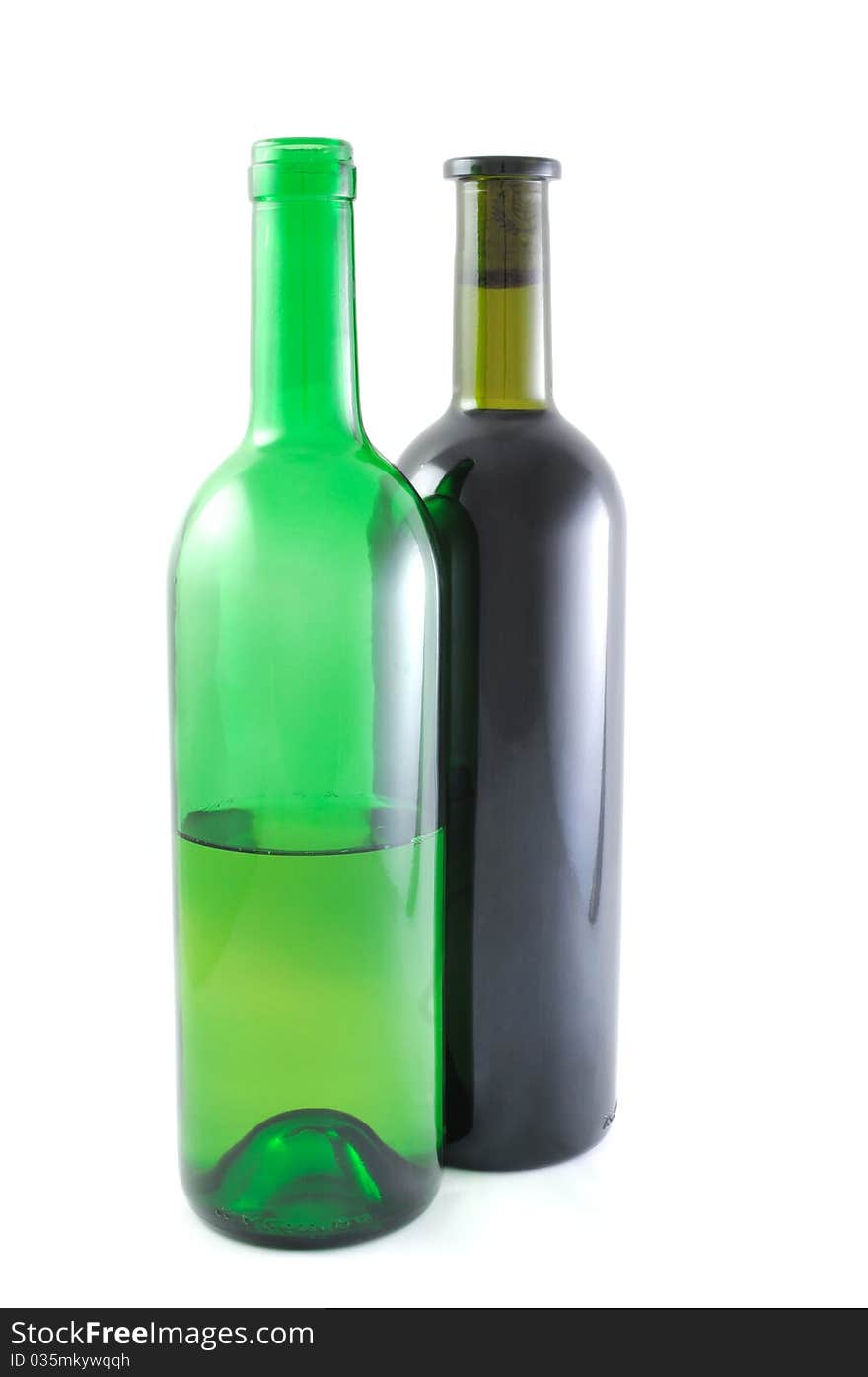 Two bottles of red and white wine, corked and half-filled, isolated on white background