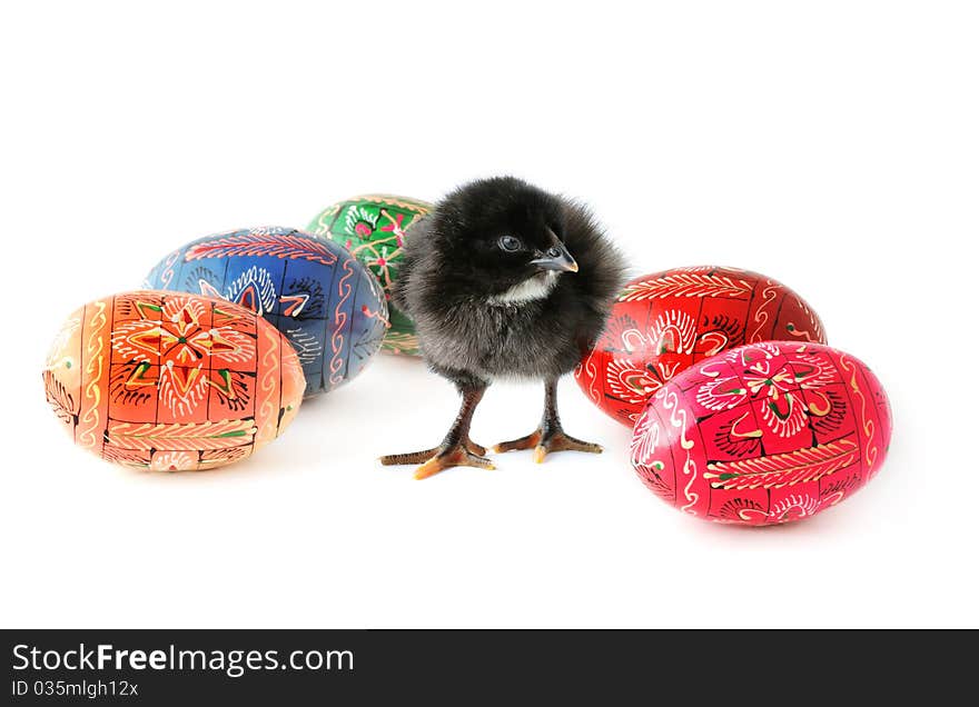 Cute baby-chicken and colorful Easter eggs isolated on white background. Cute baby-chicken and colorful Easter eggs isolated on white background