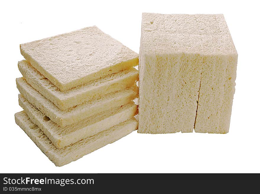 A stone-ground loaf of white bread sliced