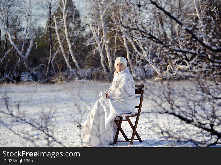 Woman in winter forest