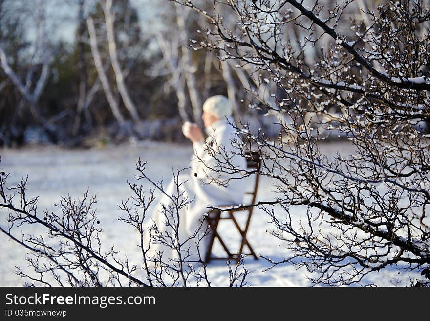 Woman in winter forest