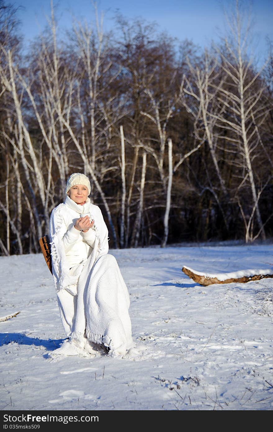 Woman in winter forest