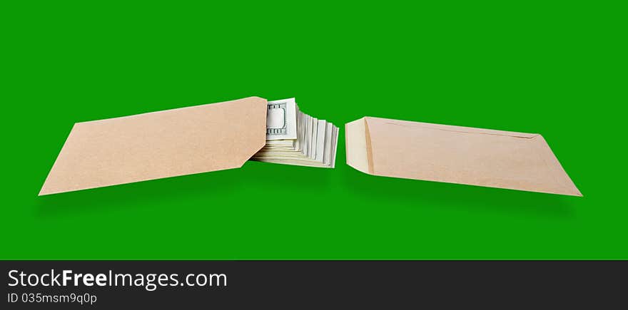 Two paper bags and dollars isolated on the green background with clipping paths. Two paper bags and dollars isolated on the green background with clipping paths.