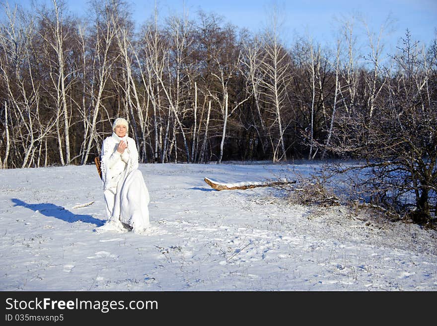 Woman in winter forest