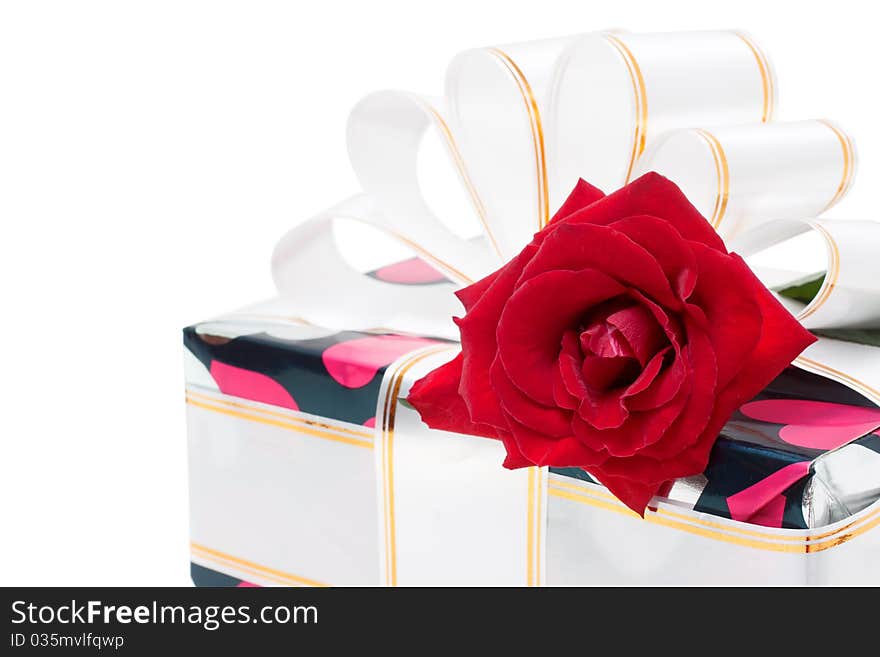 Gift decorated with ribbon and red roses