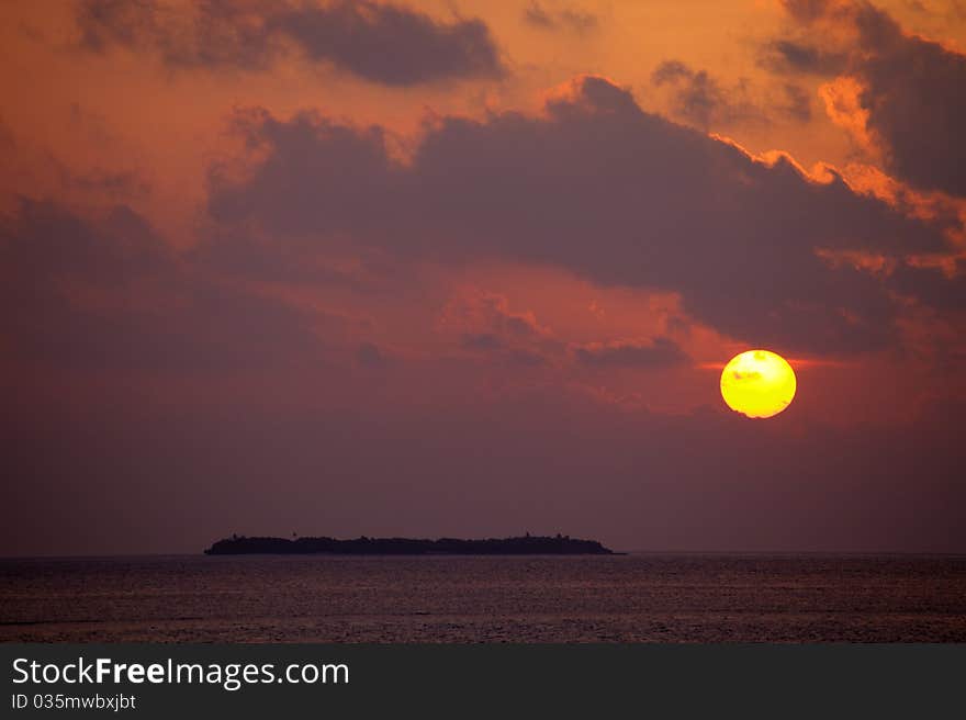 Beautiful sunset in Maldives on the ocean.