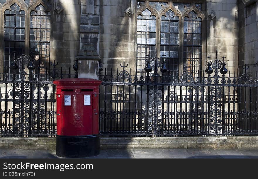 Red post box and old buildings near Westminster Abbey