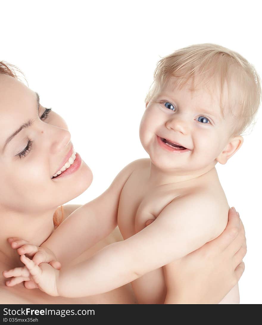 Closeup faces of young happy mother with cute baby girl isolated on white. Closeup faces of young happy mother with cute baby girl isolated on white