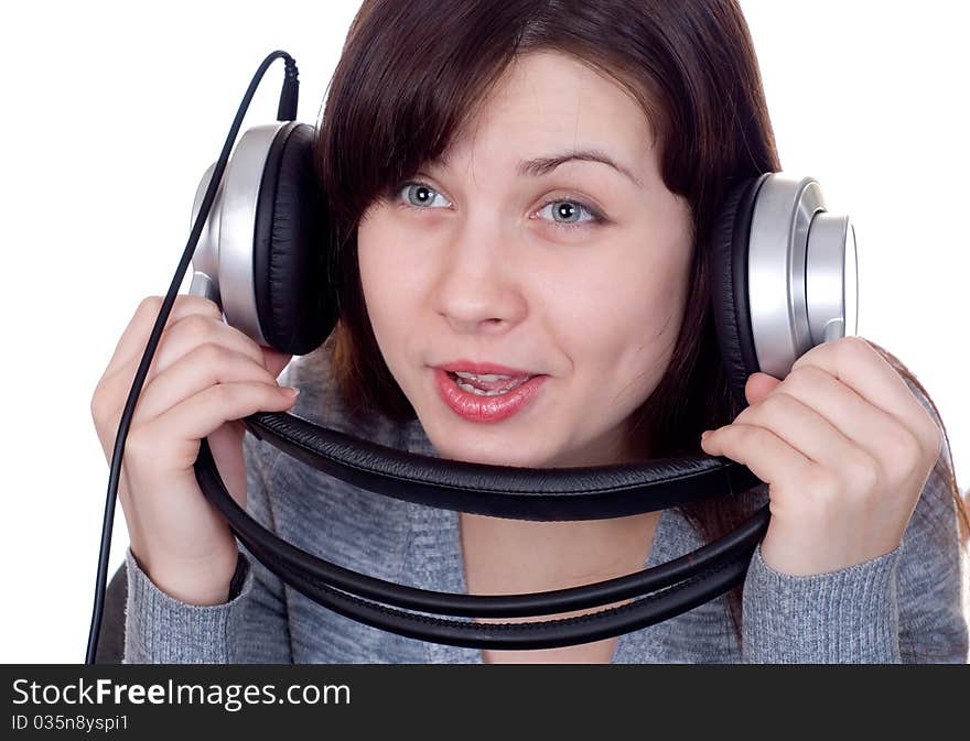 The girl in ear-phones on a white background