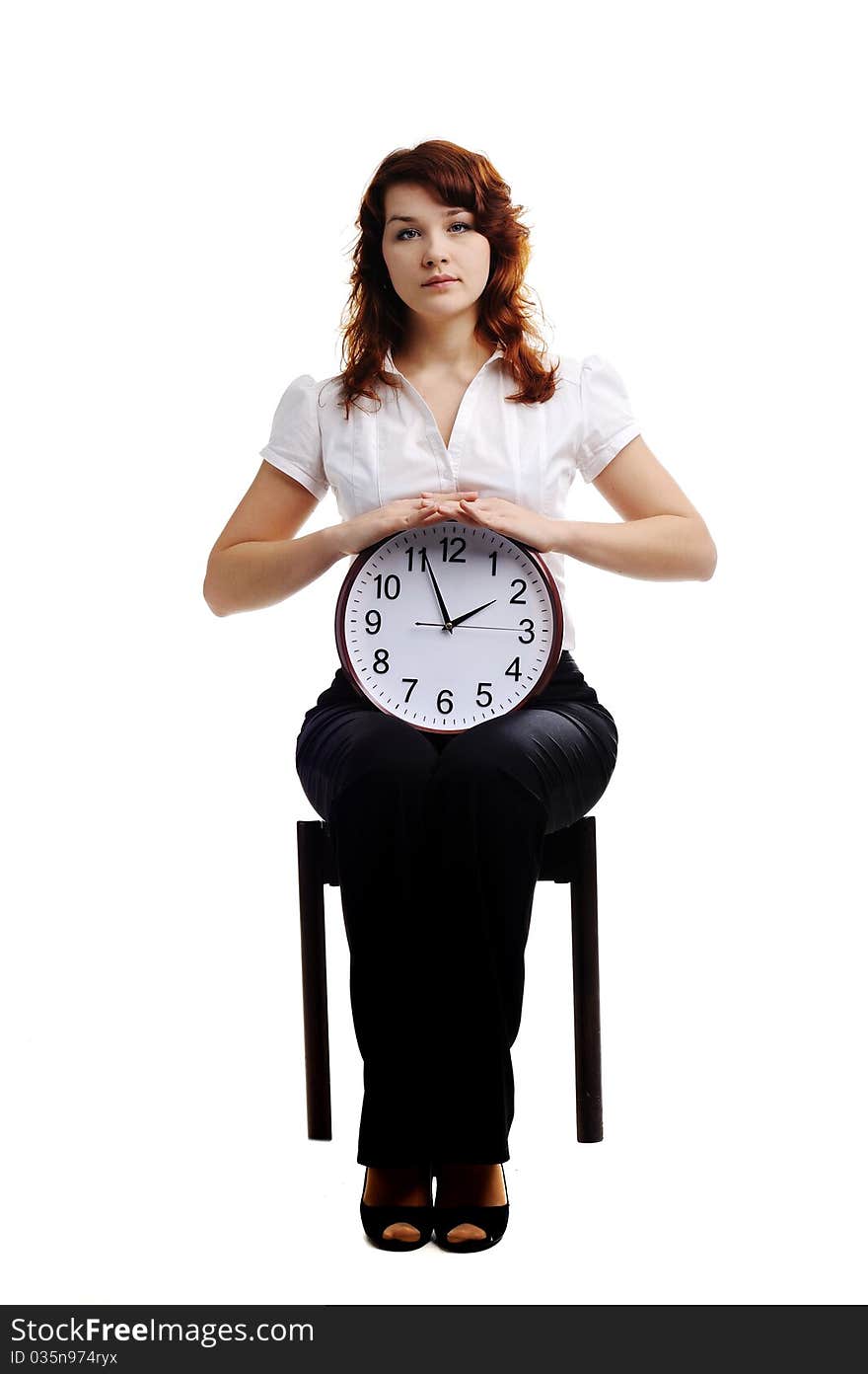 An image of a woman holding a big clock. An image of a woman holding a big clock