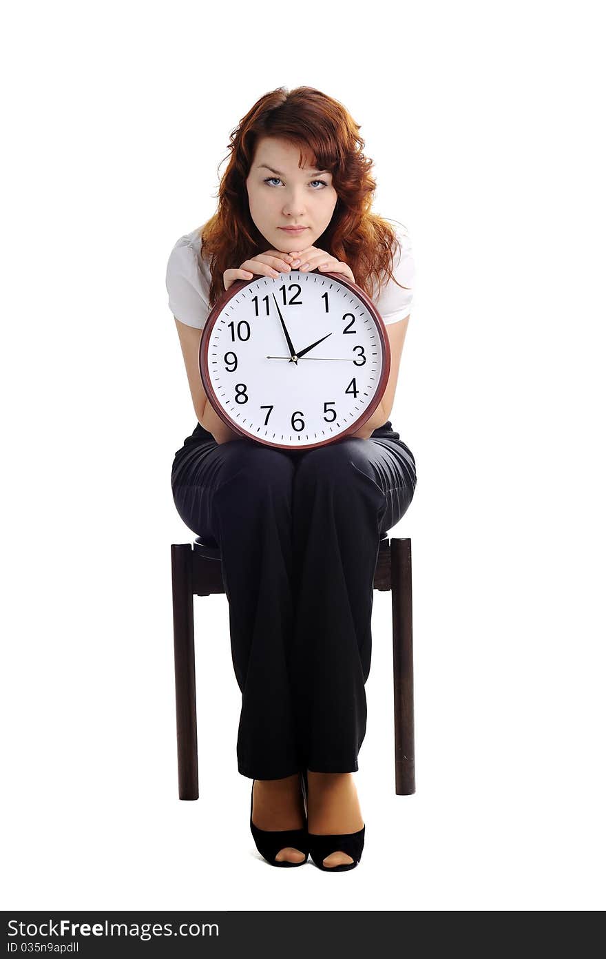 An image of a woman holding a big clock. An image of a woman holding a big clock