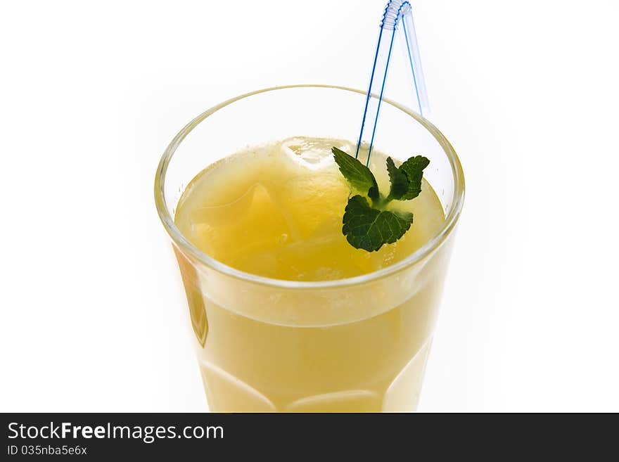 Close up of a drink in a glass beaker on a white background