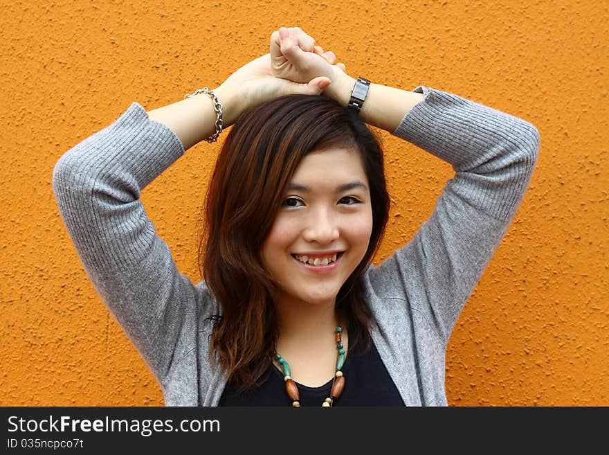 An asian girl who is smiling