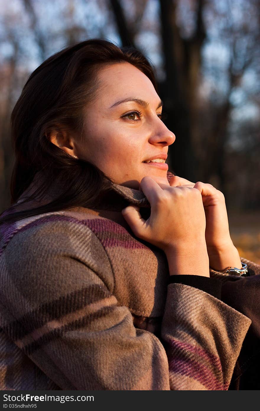 Beautiful young woman on a bench in autumn. Beautiful young woman on a bench in autumn