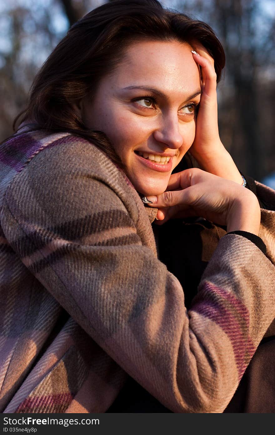 Beautiful young woman on a bench in autumn. Beautiful young woman on a bench in autumn