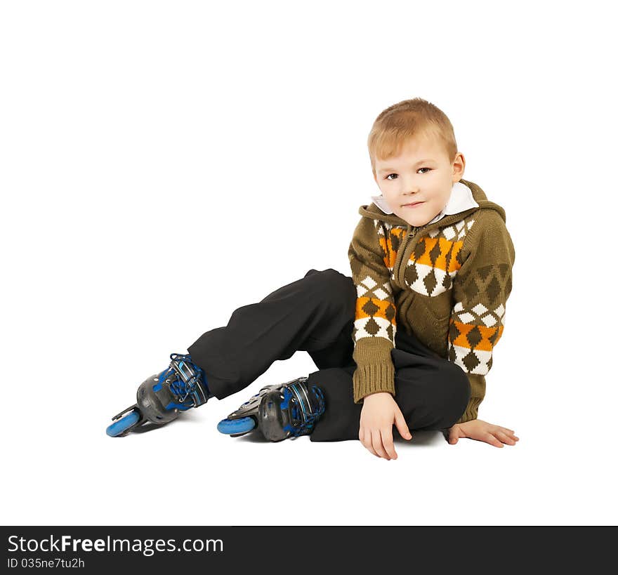 Little beautiful baby boy on roller skates