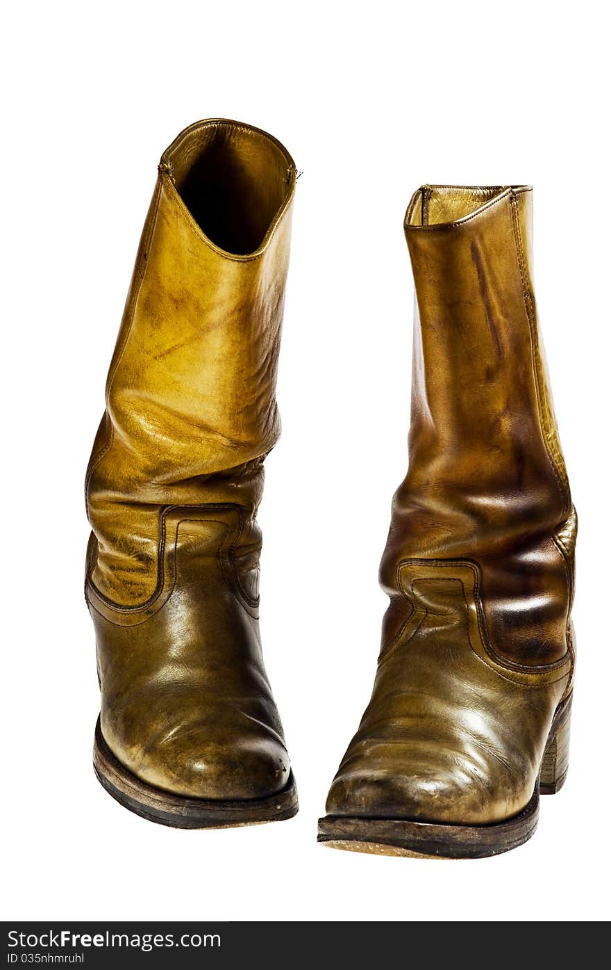 Old worn cowboy style boots from the seventies of the twentieth century - isolated