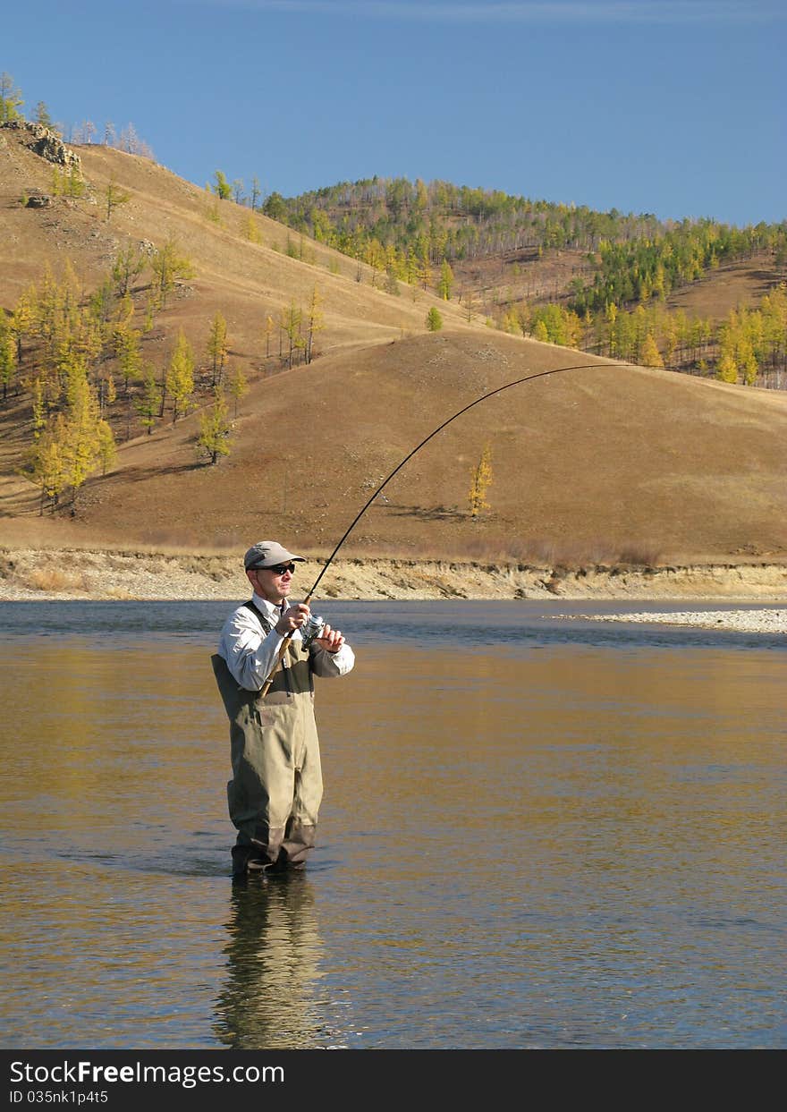 Fishing - one fisherman on river