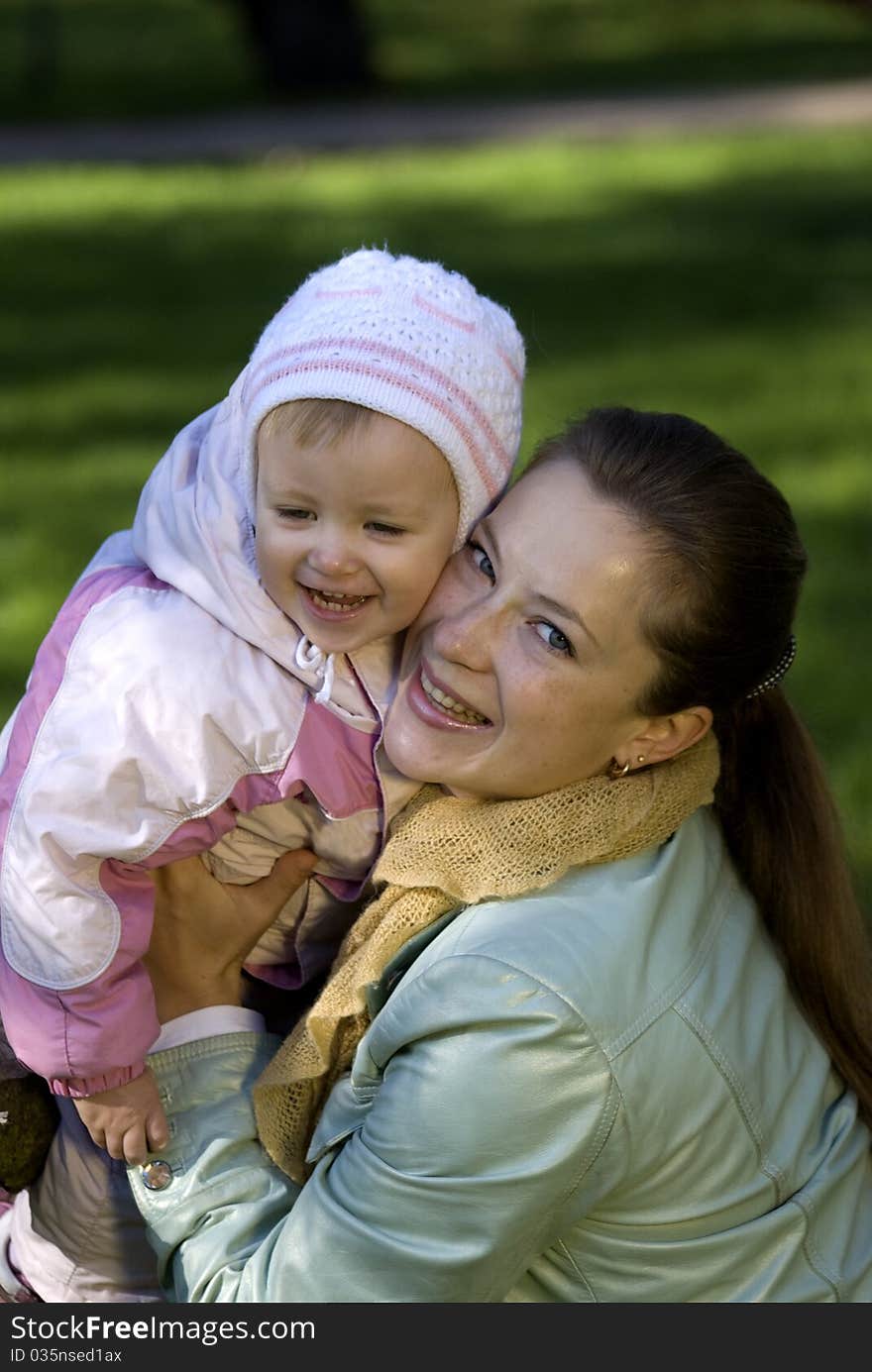 Mother and daughter playing outdoors. Mother and daughter playing outdoors