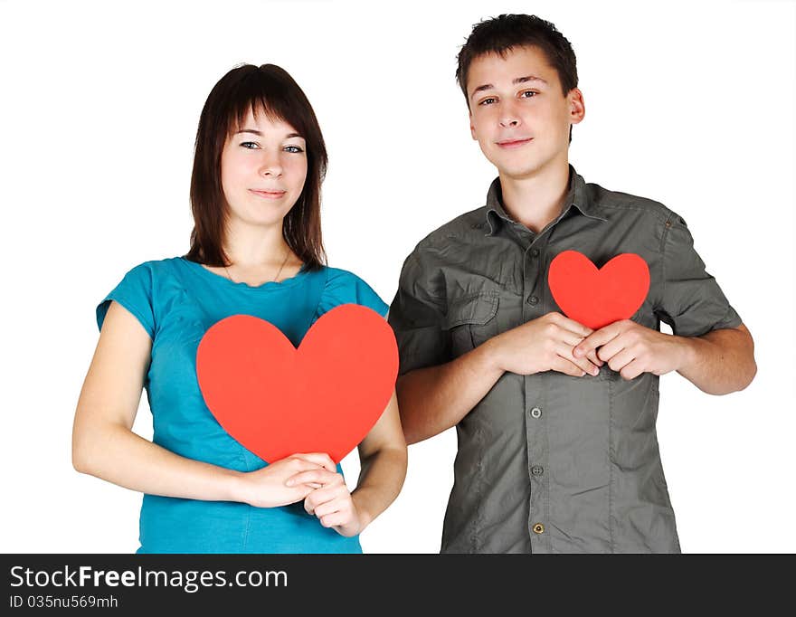 Girl and man holding two paper hearts, smiling