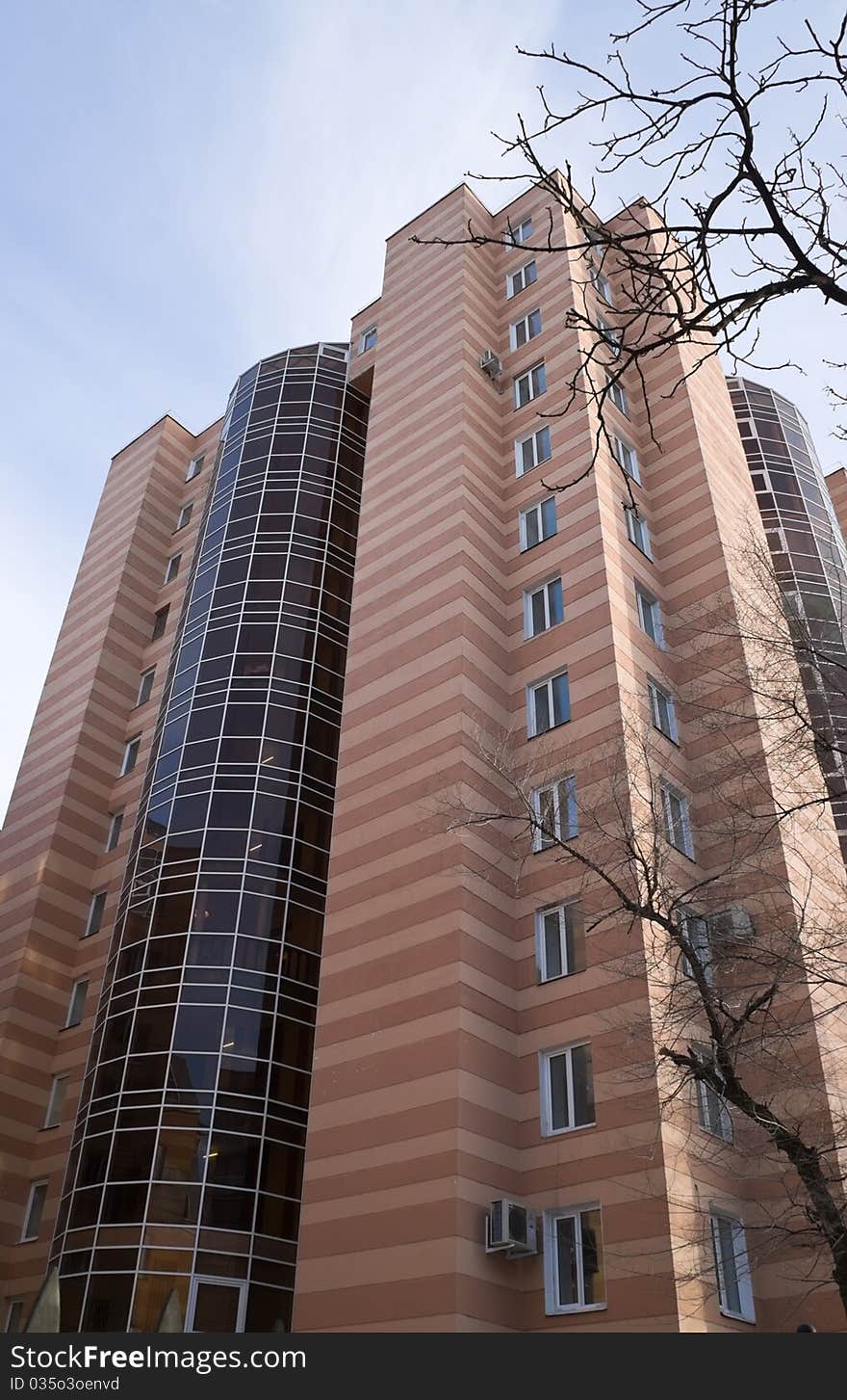 Modern high-rise building with beautiful glazed balconies