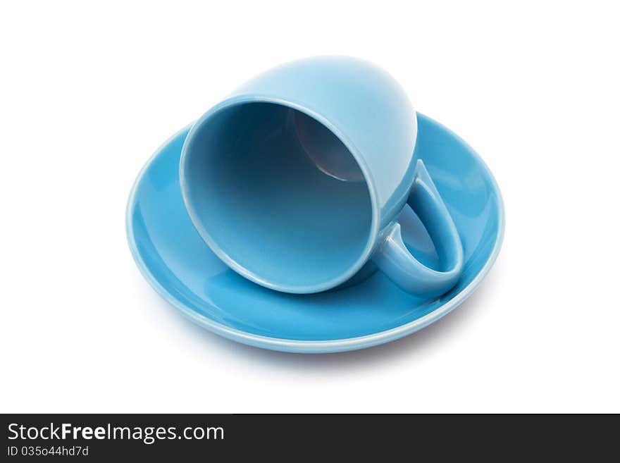 Blue coffee cup and saucer on a white background