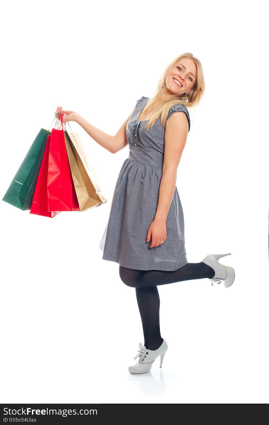 Lovely blond with shopping bags over white