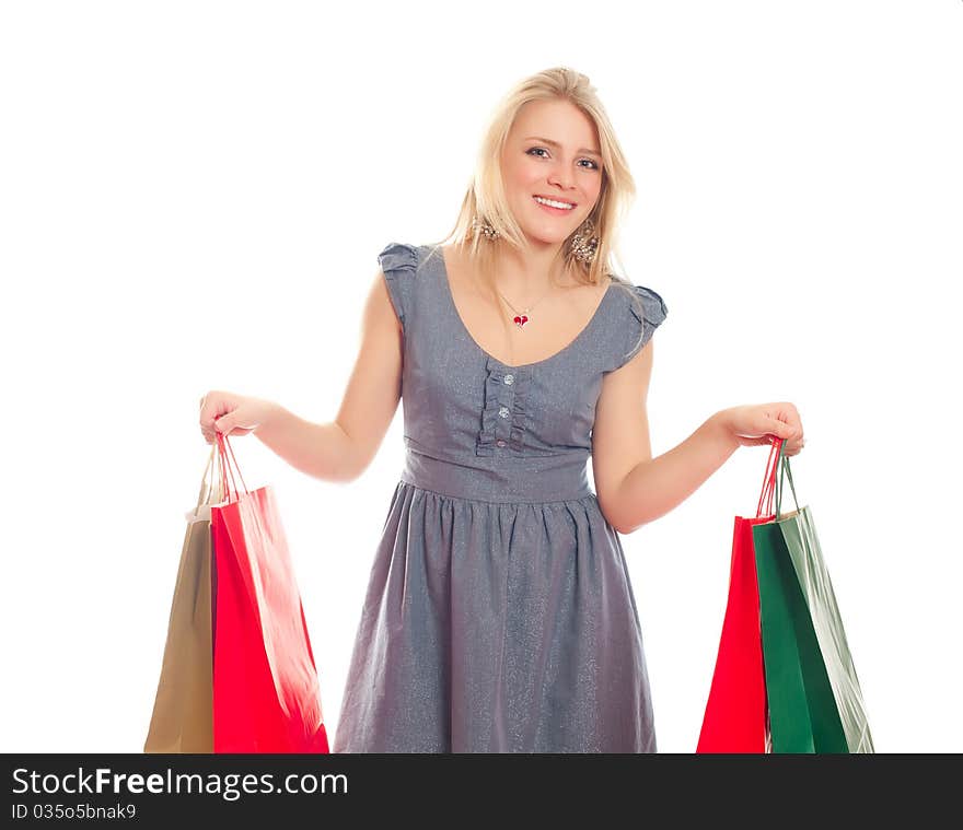 Lovely blond with shopping bags over white