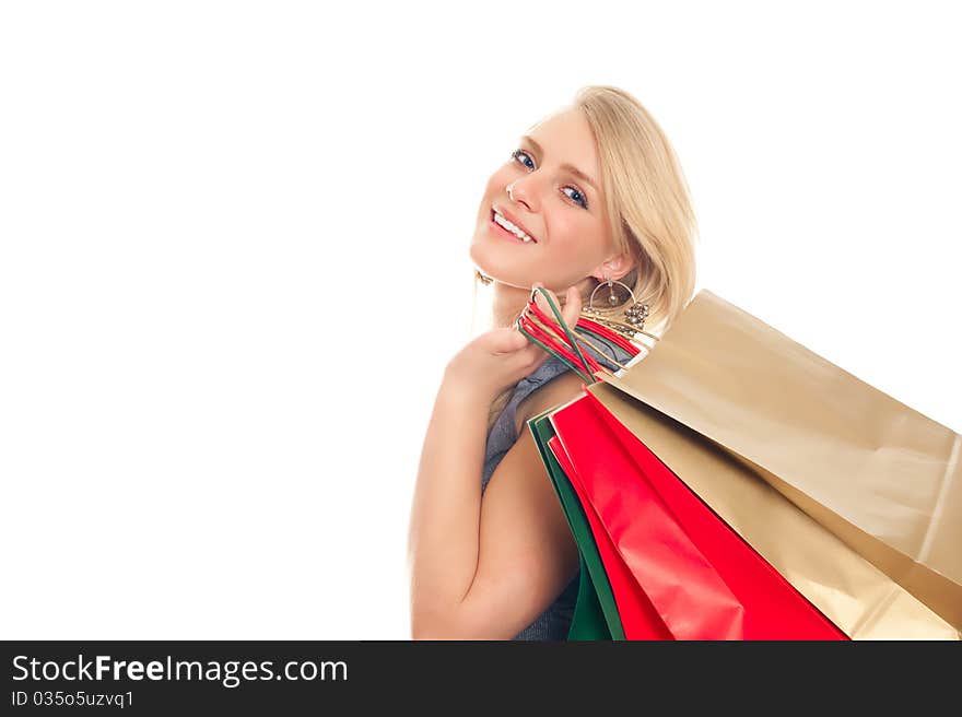 Lovely blond with shopping bags over white