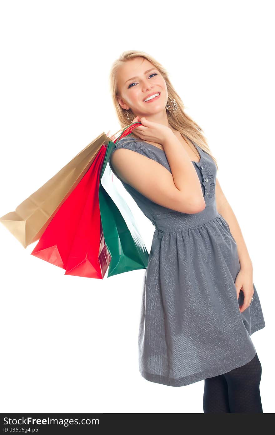 Lovely blond with shopping bags over white