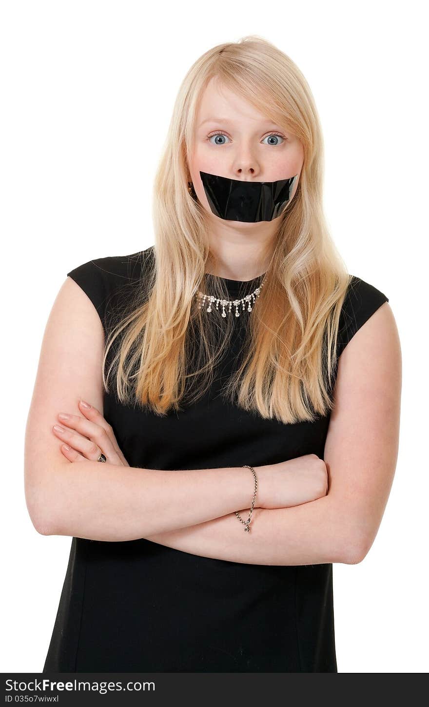 Beautiful girl with her mouth sealed with black tape