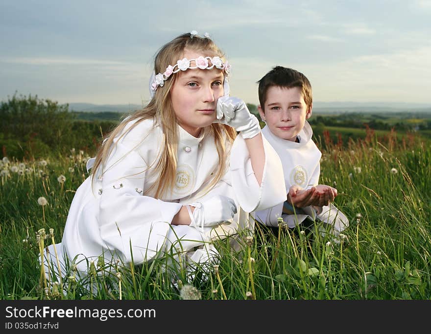 Girl in first holy communion on landscape. Girl in first holy communion on landscape