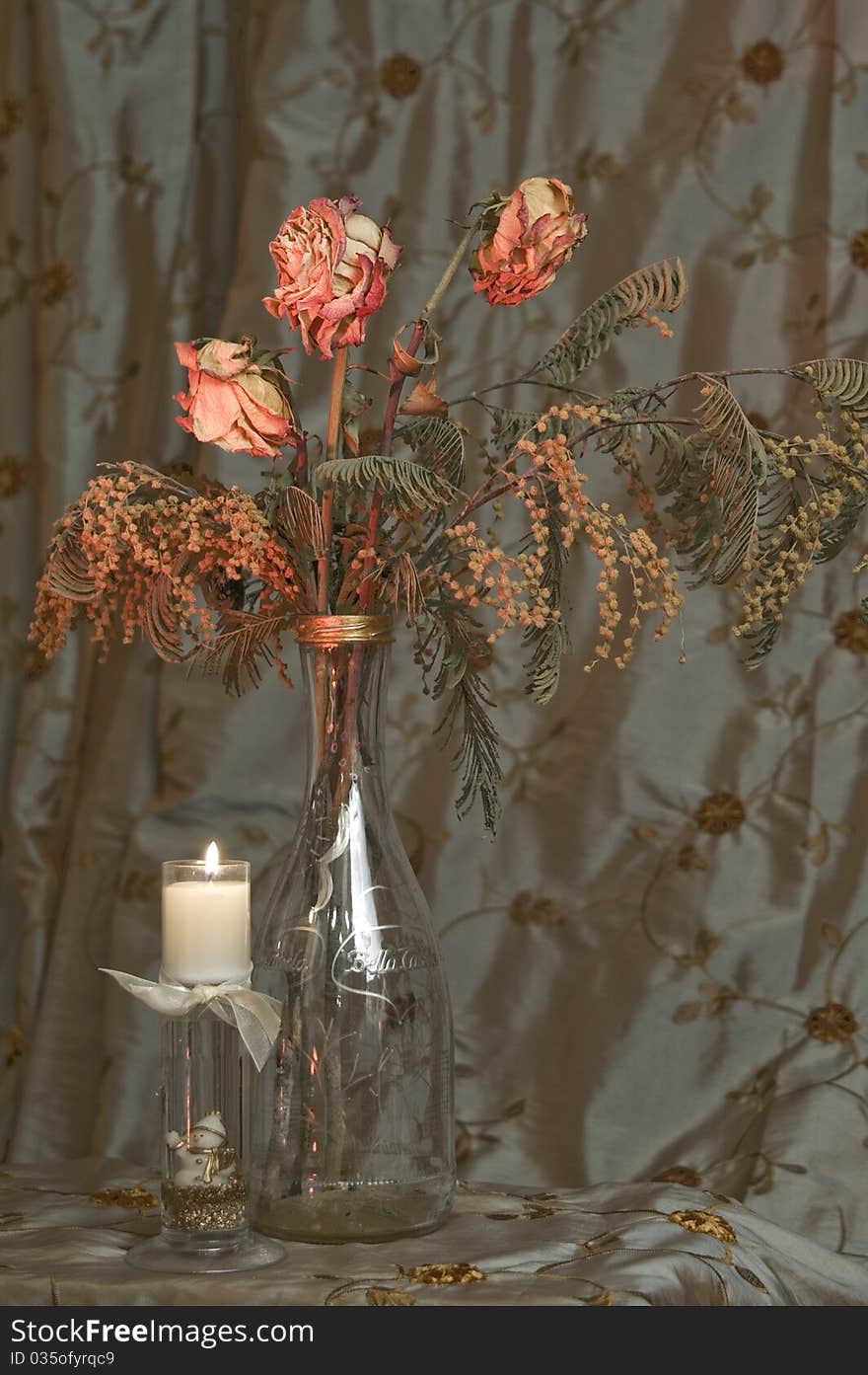 Dry Roses In Glass Bottle