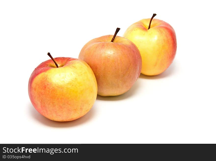 Ripe juicy apples on a white background