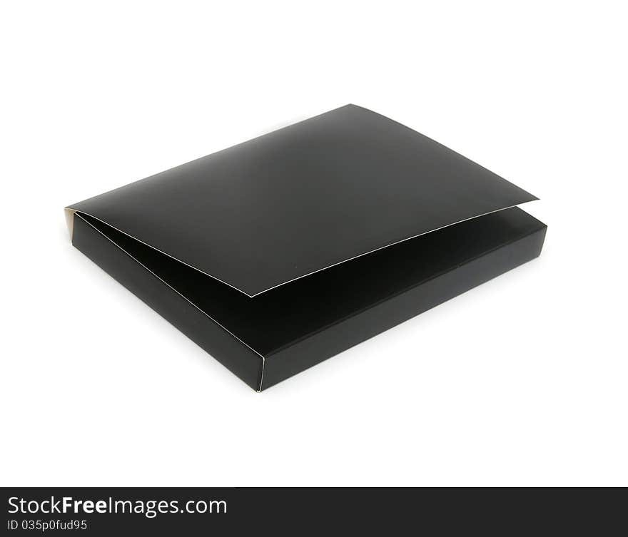 Black cardboard box with the lid off over white background with reflection.