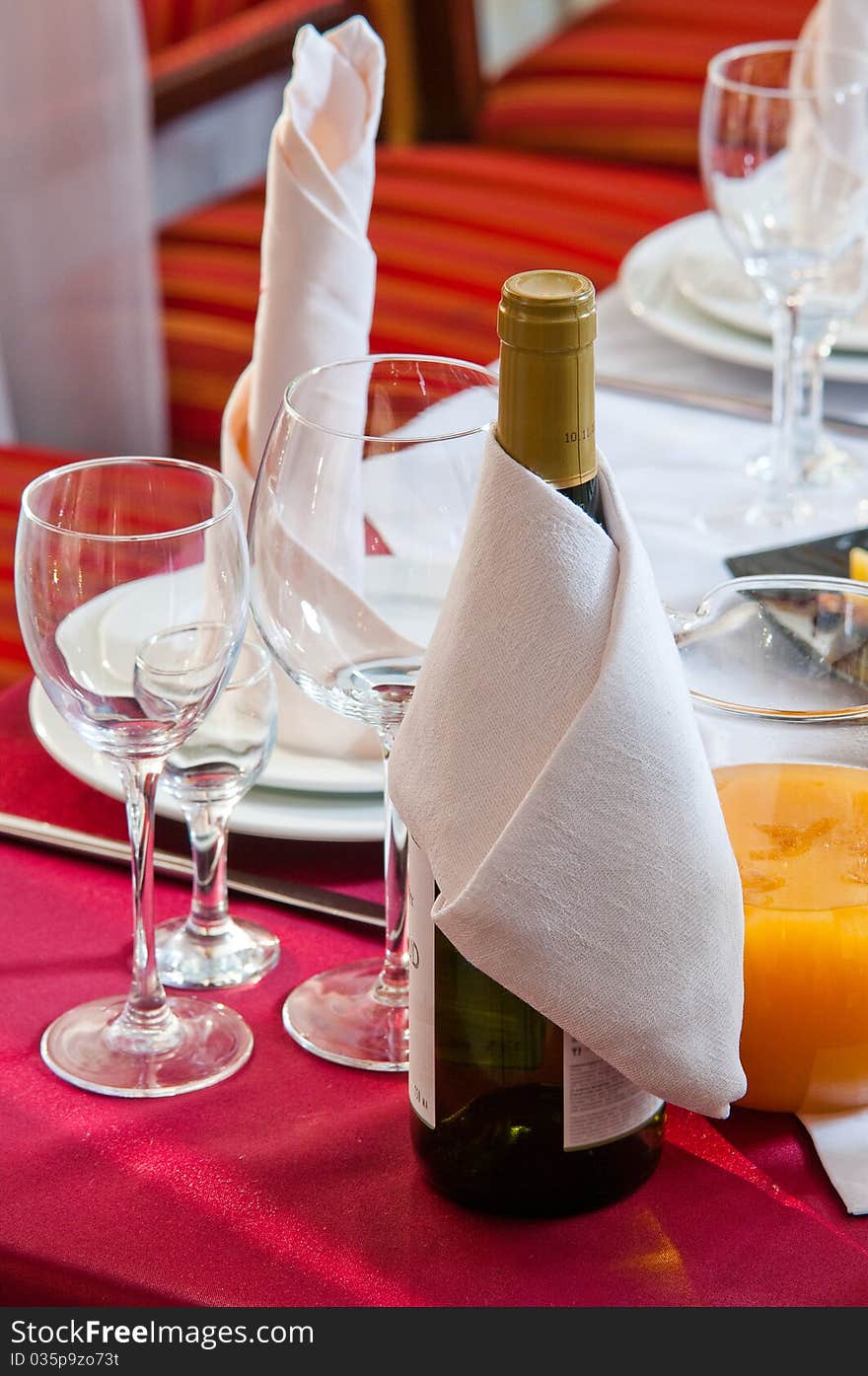 Wine bottle on a festive table during a banquet. Wine bottle on a festive table during a banquet.