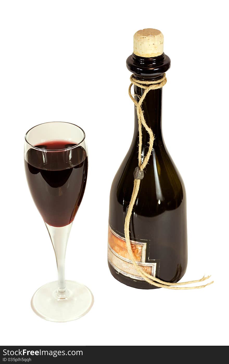 A glass of red wine and a bottle on a white background, isolated