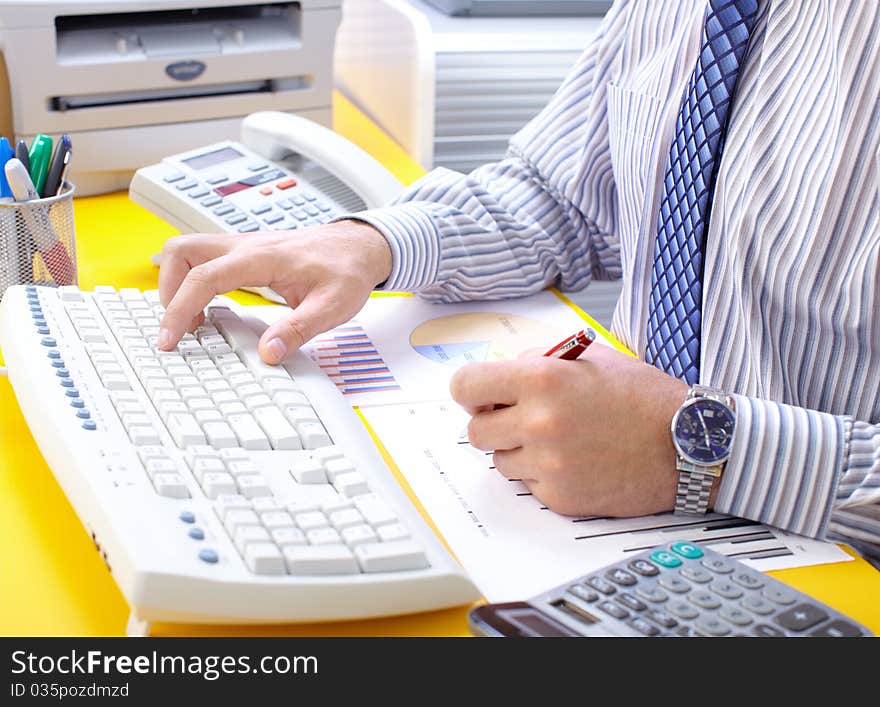 Male hands typing on a white keyboard. Male hands typing on a white keyboard