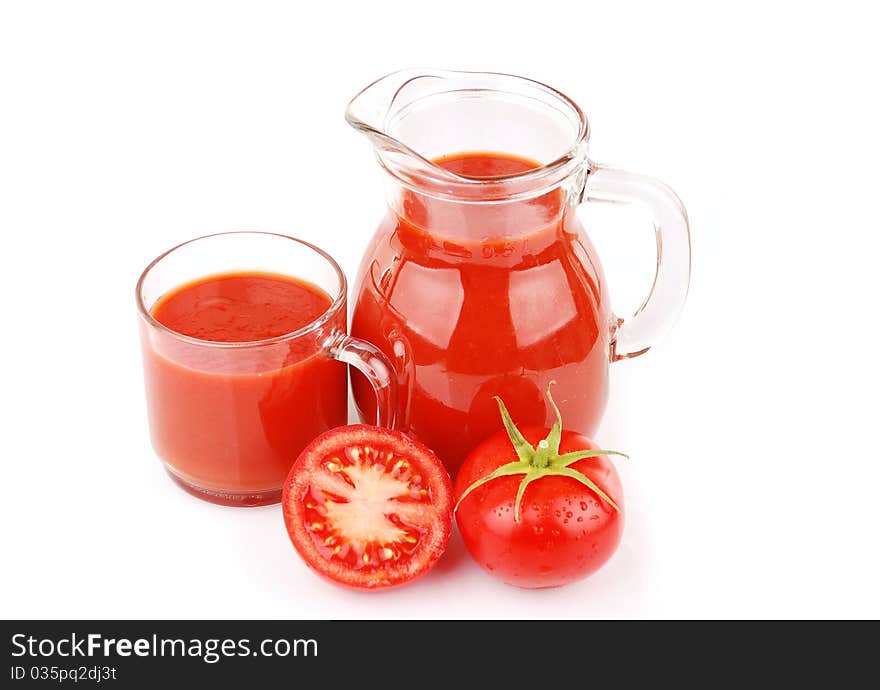 Fresh tomatoes and a glass full of tomato juice. Fresh tomatoes and a glass full of tomato juice