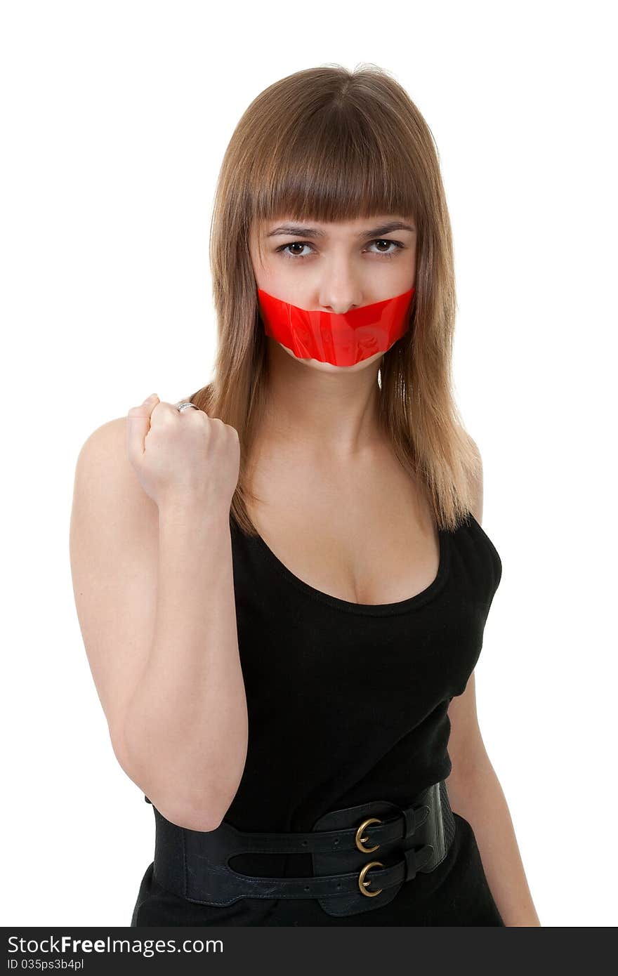 Beautiful girl with her mouth sealed with red tape