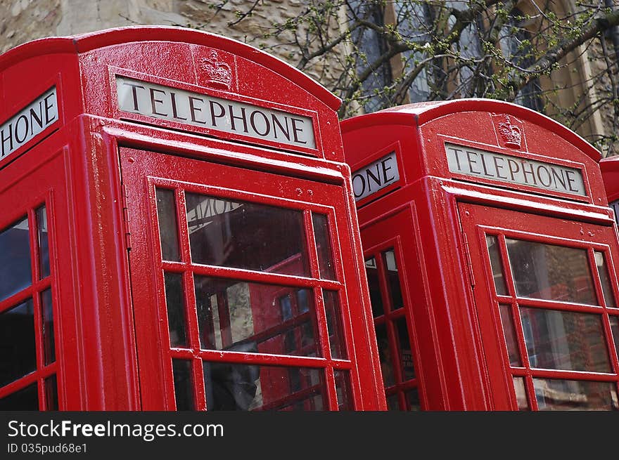 Two traditional red phone boxes