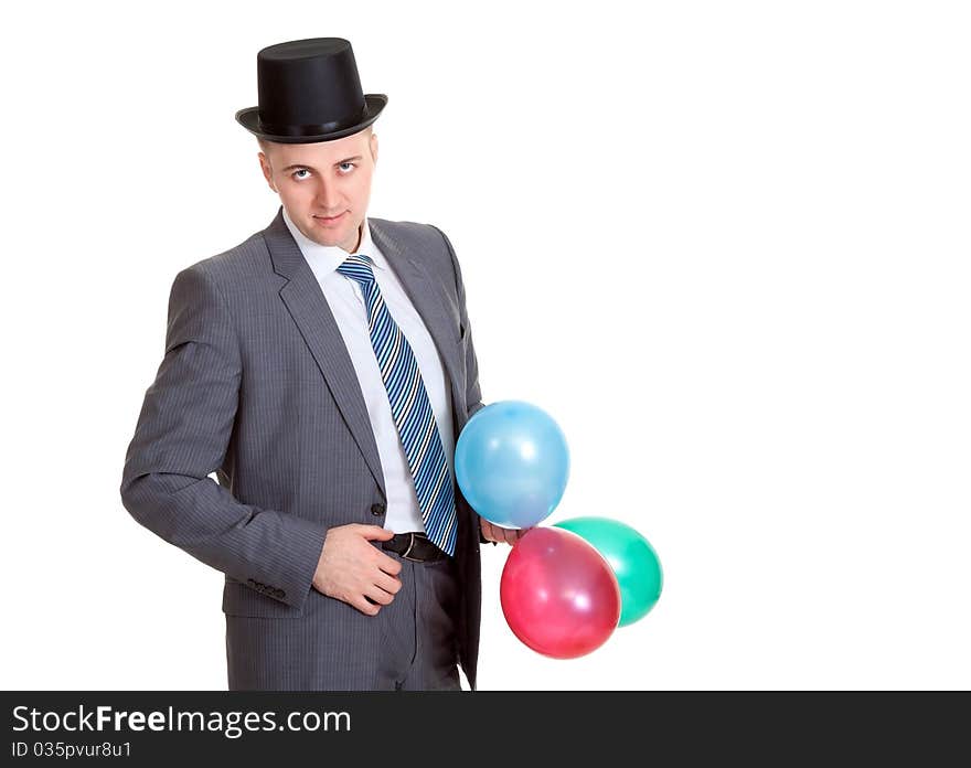 Businessman in a black hat with inflatable colored balls