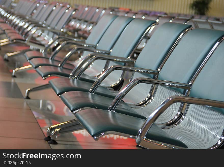 Chairs lined at the departure/arrival hall of an airport in Kuala Lumpur, Malaysia. Chairs lined at the departure/arrival hall of an airport in Kuala Lumpur, Malaysia