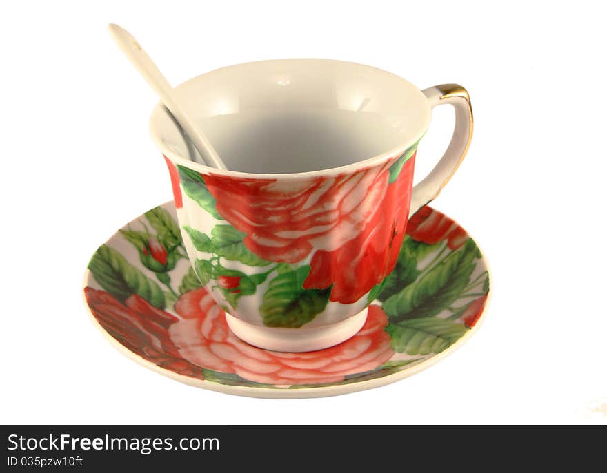 Empty tea cup with a spoon  on a white background