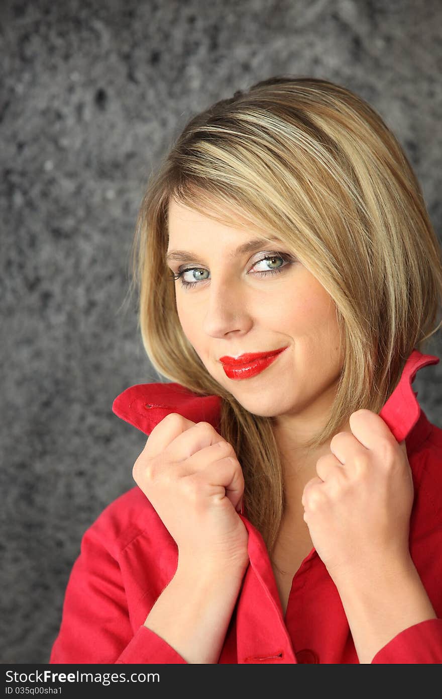 Young woman with red coat and red lipstick. Young woman with red coat and red lipstick