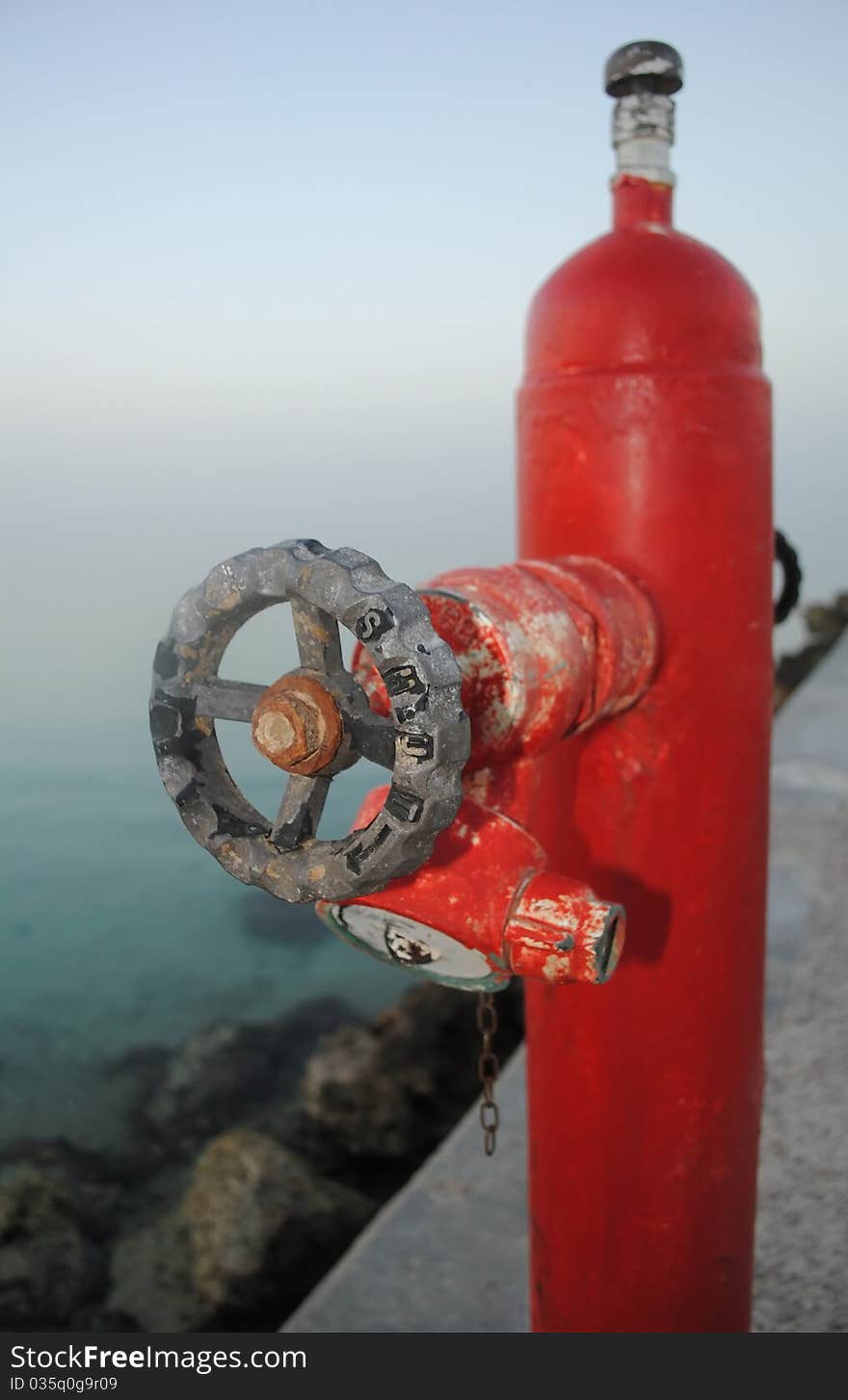 Red fire hydrant on seacoast