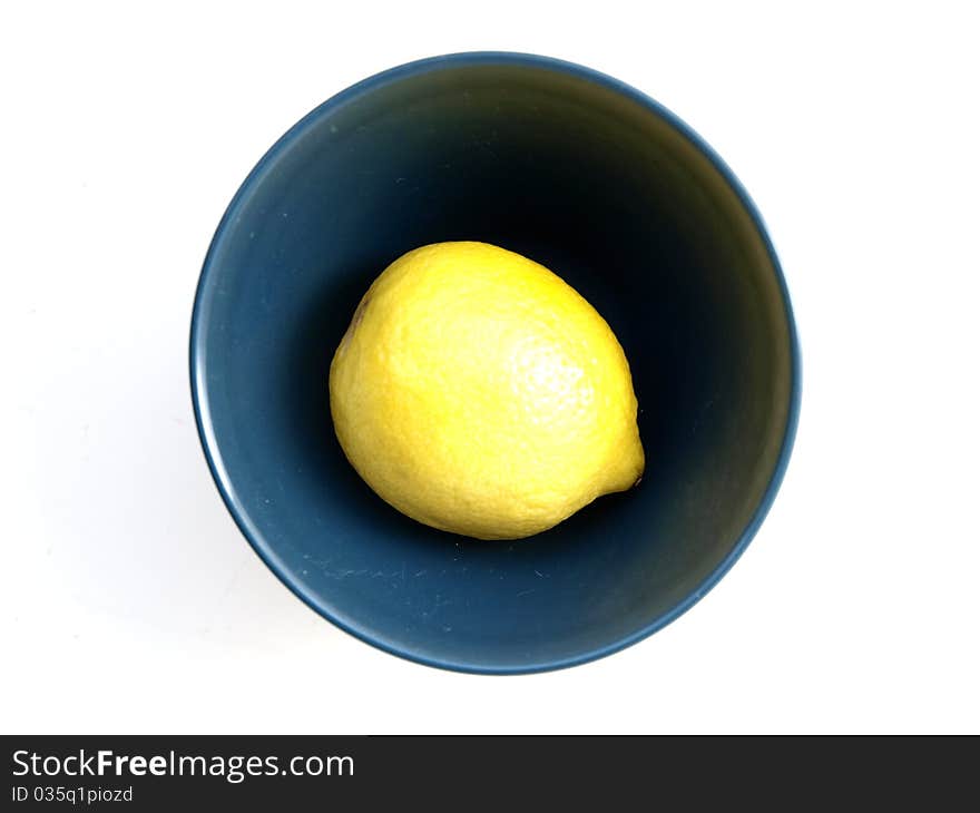 Lemon in a bowl on a white background