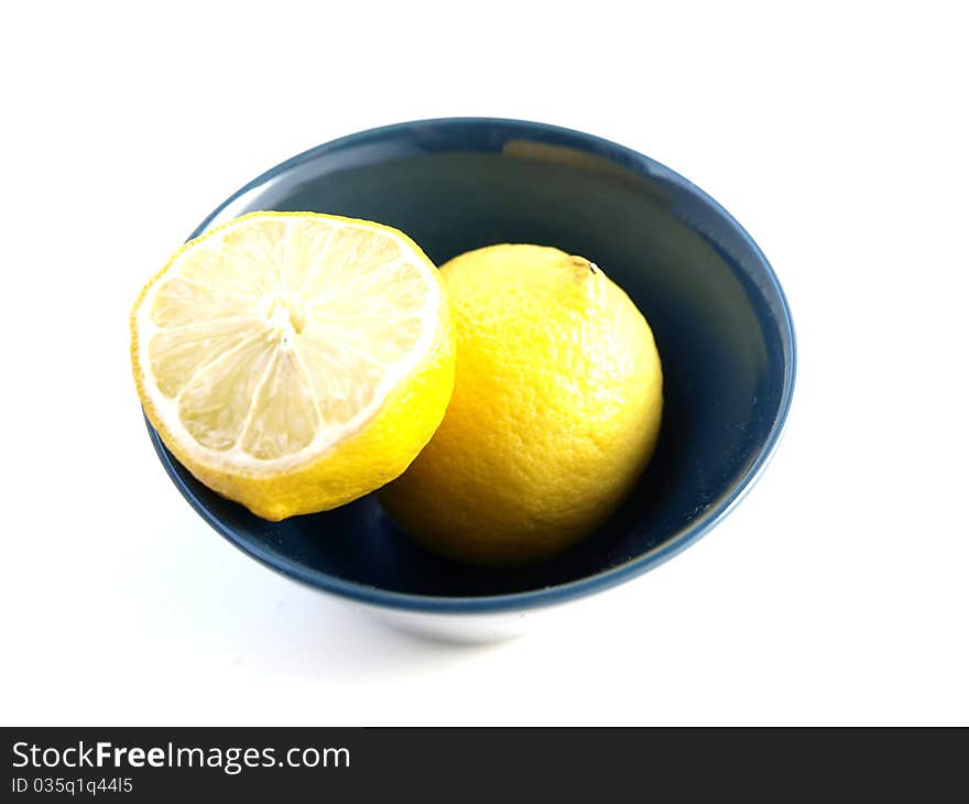 Lemon in a bowl on a white background