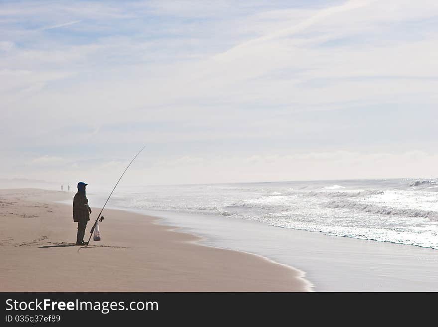 Fisherman at the shore of the pacific ocean. Fisherman at the shore of the pacific ocean